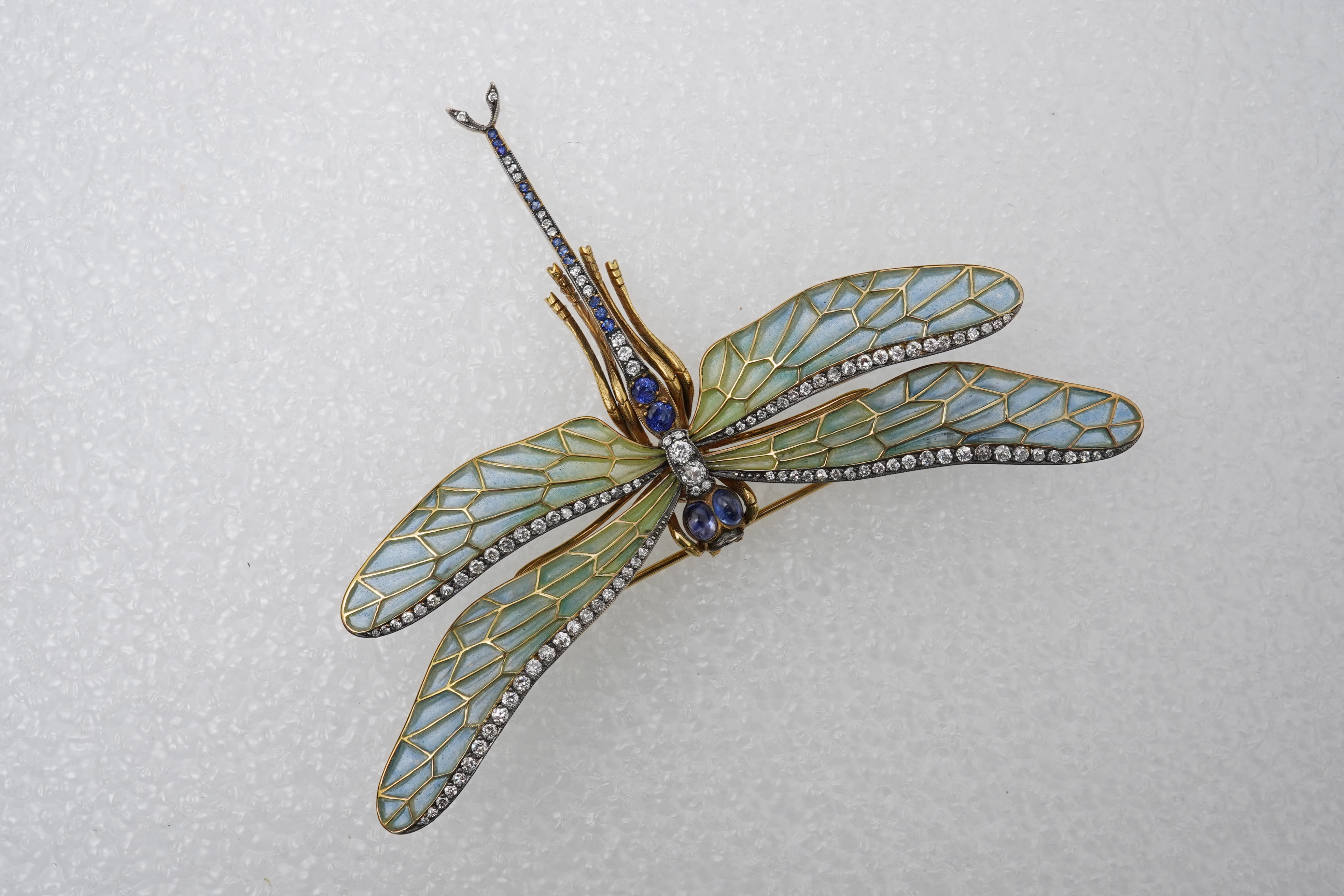 An enamel, sapphire and diamond dragonfly brooch